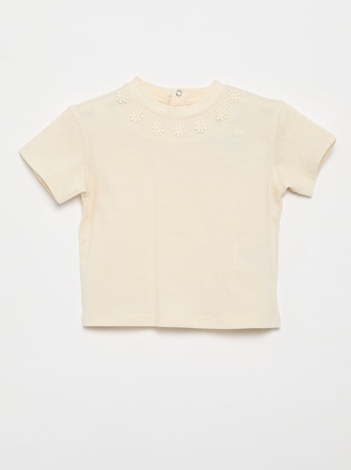 T-shirt a tinta unita con fiori fantasia sul colletto - Kiabi