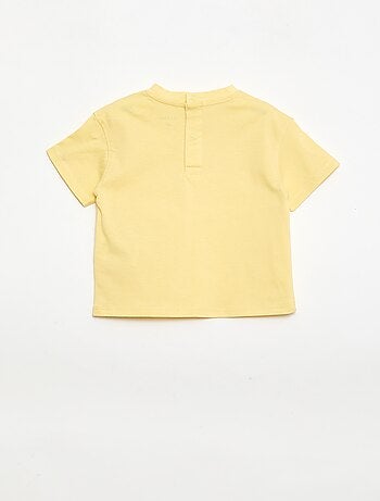 T-shirt a tinta unita con fiori fantasia sul colletto