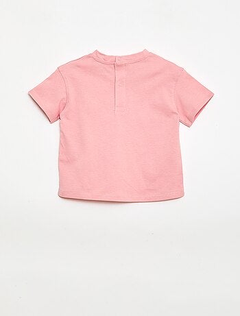 T-shirt a tinta unita con fiori fantasia sul colletto