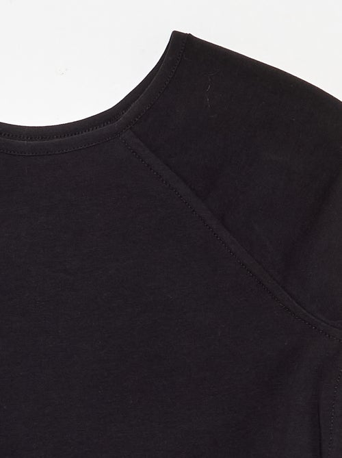 T-shirt a tinta unita con maniche raglan - Kiabi T-shirt a tinta unita con maniche raglan - Kiabi