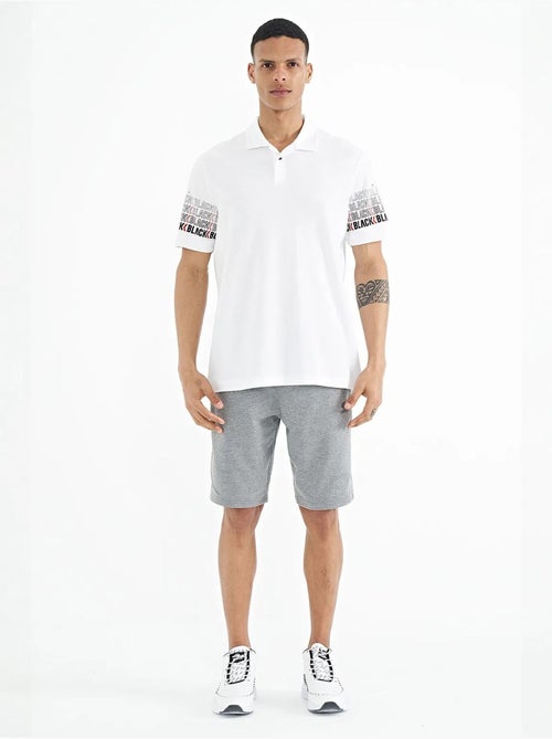 T-shirt con colletto polo stampata tommy - Kiabi T-shirt con colletto polo stampata tommy - Kiabi