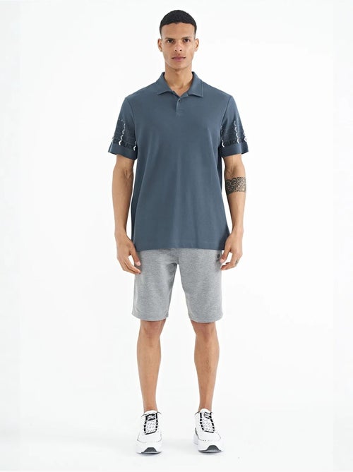 T-shirt con colletto polo stampata tommy - Kiabi T-shirt con colletto polo stampata tommy - Kiabi