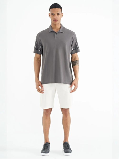 T-shirt con colletto polo stampata tommy - Kiabi T-shirt con colletto polo stampata tommy - Kiabi