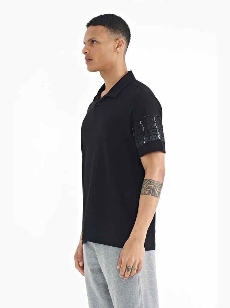 T-shirt con colletto polo stampata tommy Nero - Kiabi