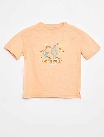 T-shirt con cut out fantasia e ricami