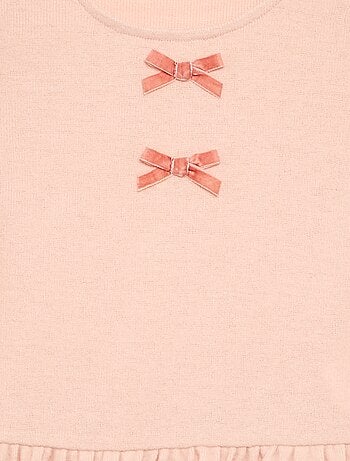 T-shirt con nodi e balza in vita