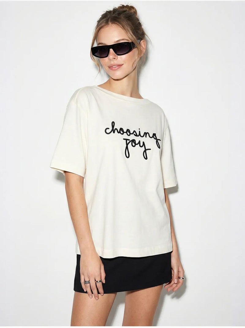 T-shirt da donna in cotone con scollo a barca e stampa lucci Bianco sporco - Kiabi