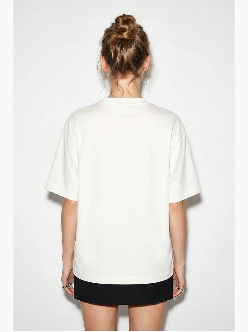 T-shirt da donna in cotone con scollo a barca e stampa lucci Bianco sporco - Kiabi