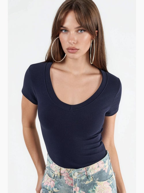 T-shirt elastica a maniche corte con scollo a v busem - Kiabi T-shirt elastica a maniche corte con scollo a v busem - Kiabi
