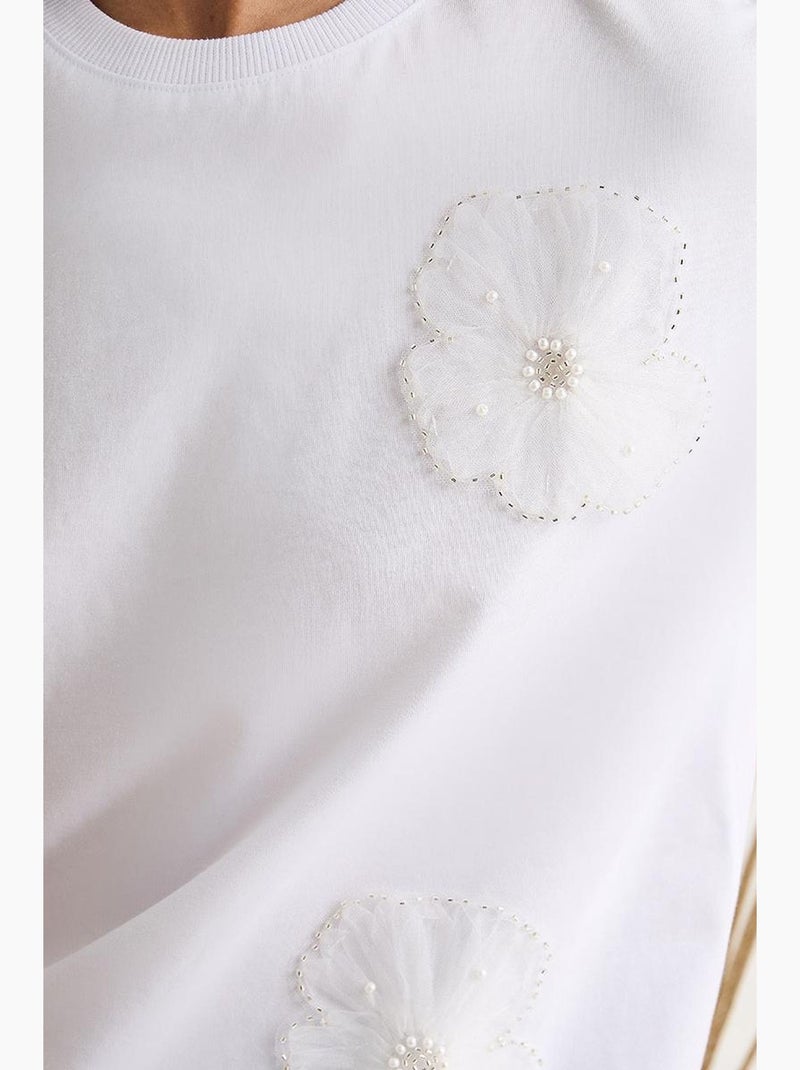 T-shirt girocollo a maniche corte con accessorio floreale lucci Bianco - Kiabi