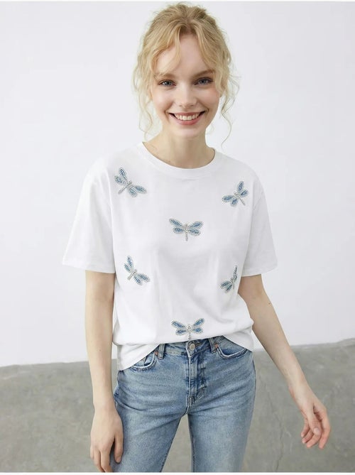 T-shirt girocollo a vestibilità comoda con ricamo lucci - Kiabi T-shirt girocollo a vestibilità comoda con ricamo lucci - Kiabi