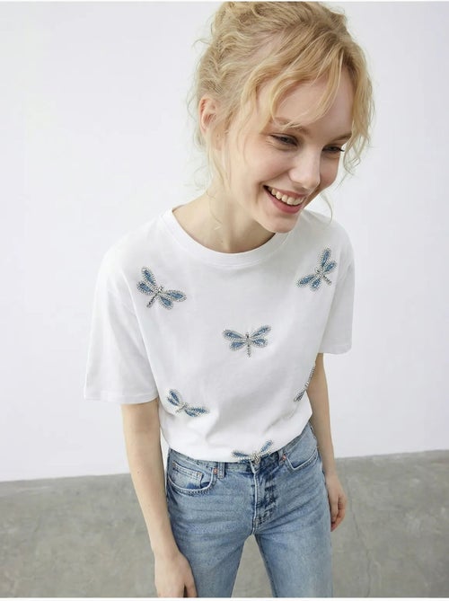 T-shirt girocollo a vestibilità comoda con ricamo lucci - Kiabi T-shirt girocollo a vestibilità comoda con ricamo lucci - Kiabi