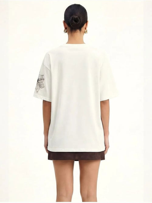 T-shirt girocollo con ricamo floreale lucci - Kiabi T-shirt girocollo con ricamo floreale lucci - Kiabi
