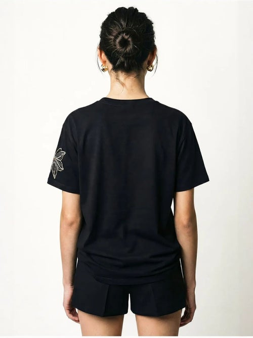 T-shirt girocollo con ricamo floreale lucci - Kiabi T-shirt girocollo con ricamo floreale lucci - Kiabi