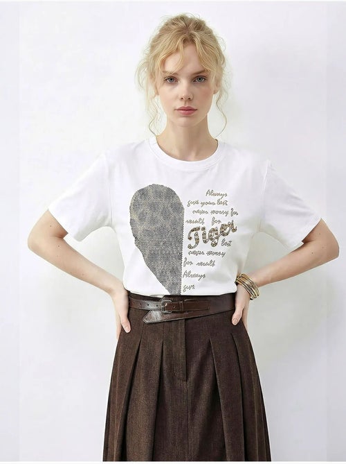 T-shirt girocollo con stampa di paillettes e testo lucci - Kiabi T-shirt girocollo con stampa di paillettes e testo lucci - Kiabi