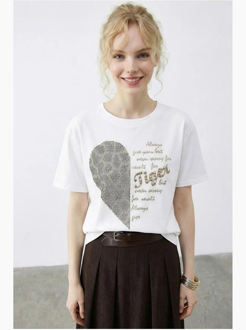 T-shirt girocollo con stampa di paillettes e testo lucci - Kiabi T-shirt girocollo con stampa di paillettes e testo lucci - Kiabi
