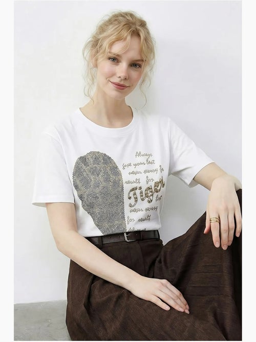 T-shirt girocollo con stampa di paillettes e testo lucci - Kiabi T-shirt girocollo con stampa di paillettes e testo lucci - Kiabi