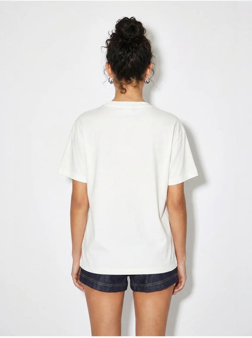 T-shirt girocollo in cotone con ricamo lucci - Kiabi T-shirt girocollo in cotone con ricamo lucci - Kiabi
