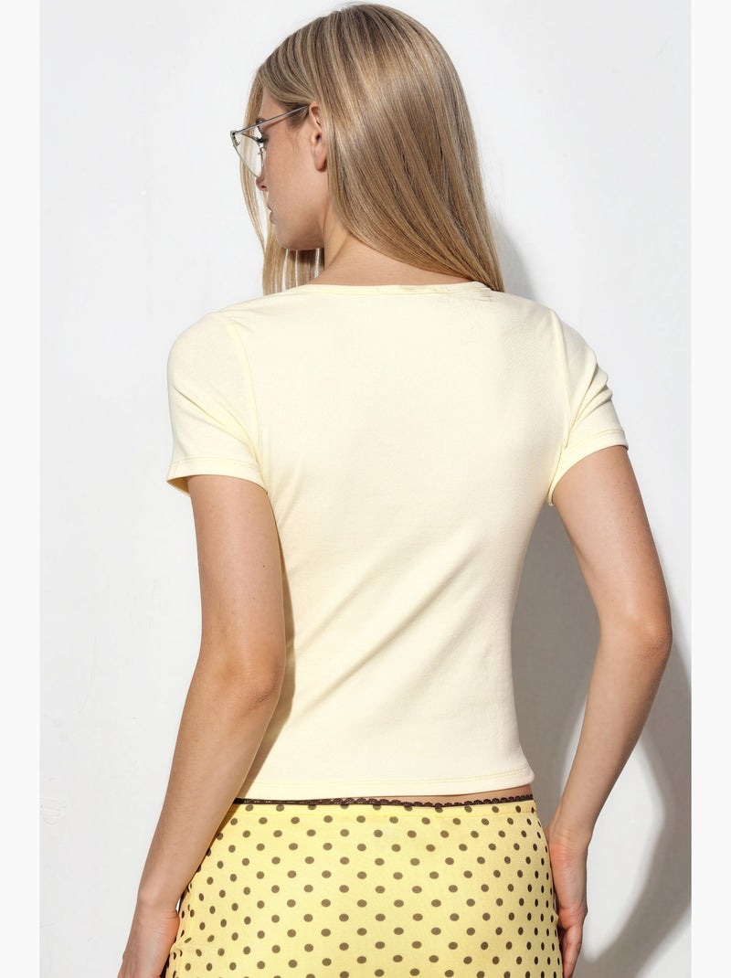 T-shirt girocollo in maglia manica corta con bottoni busem Giallo limone - Kiabi