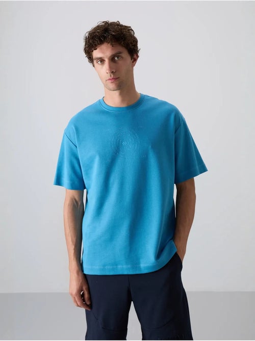 T-shirt girocollo oversize in misto cotone tommy - Kiabi T-shirt girocollo oversize in misto cotone tommy - Kiabi