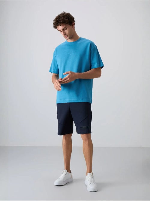 T-shirt girocollo oversize in misto cotone tommy - Kiabi T-shirt girocollo oversize in misto cotone tommy - Kiabi