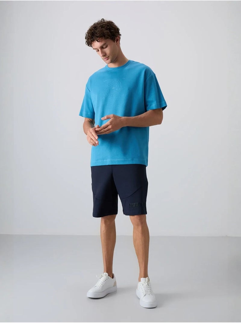 T-shirt girocollo oversize in misto cotone tommy Blu - Kiabi