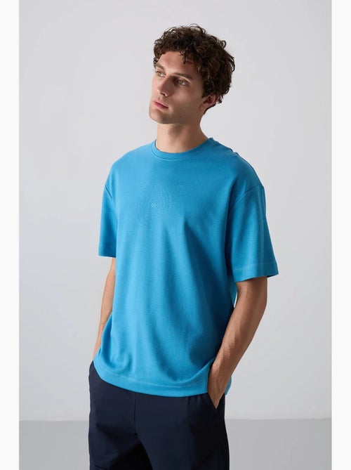 T-shirt girocollo oversize in misto cotone tommy - Kiabi T-shirt girocollo oversize in misto cotone tommy - Kiabi