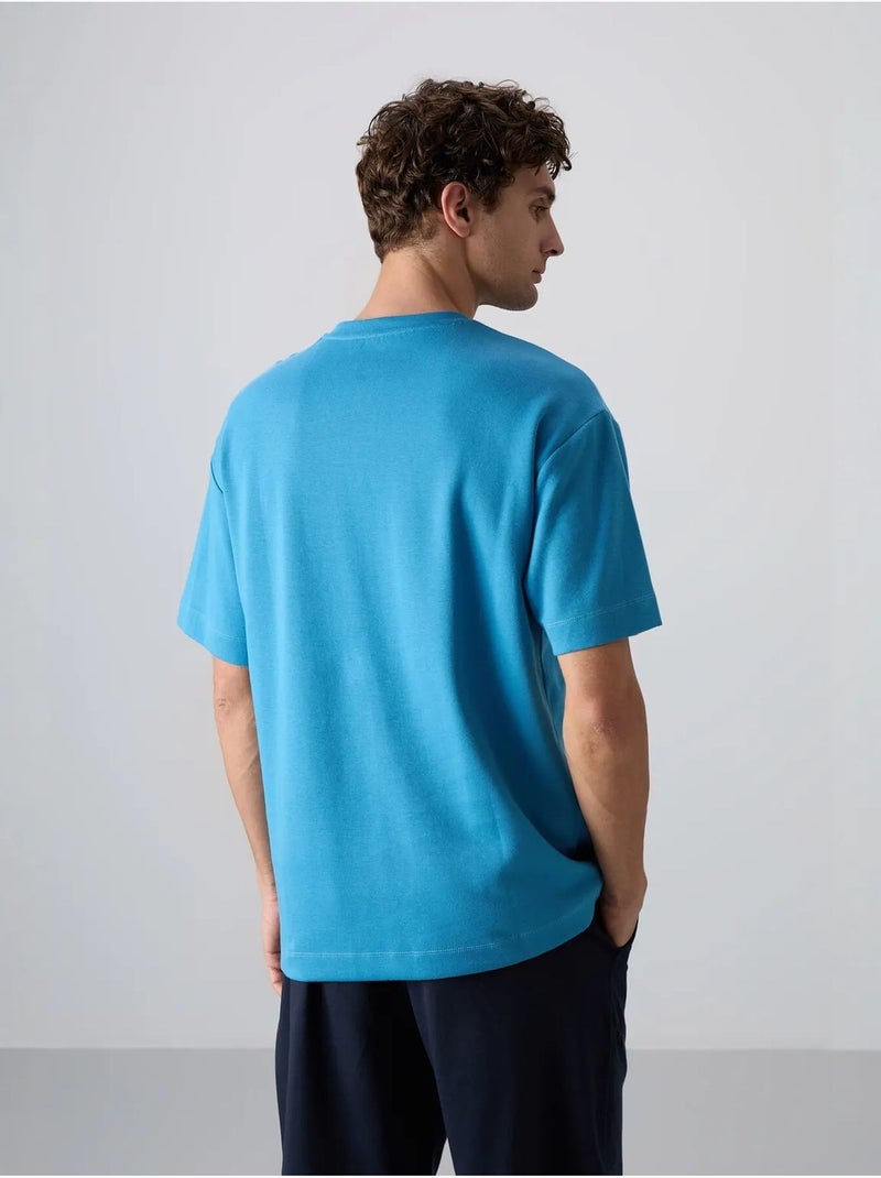 T-shirt girocollo oversize in misto cotone tommy Blu - Kiabi