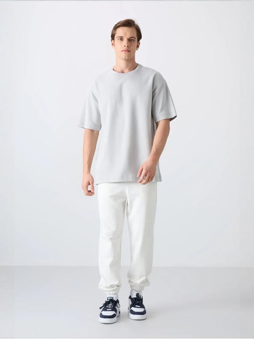T-shirt girocollo oversize in misto cotone tommy - Kiabi