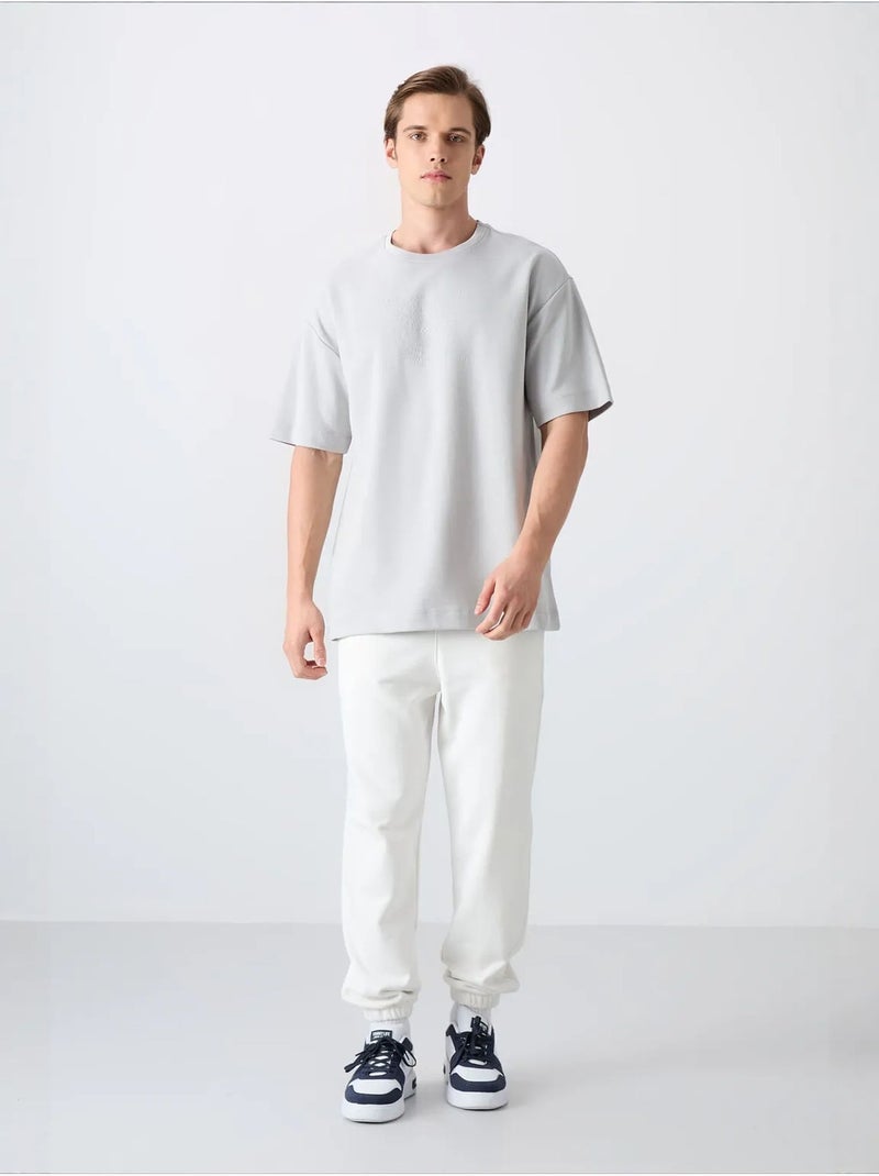 T-shirt girocollo oversize in misto cotone tommy Grigio chiaro - Kiabi