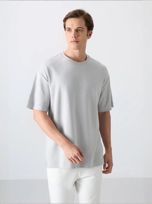 T-shirt girocollo oversize in misto cotone tommy - Kiabi