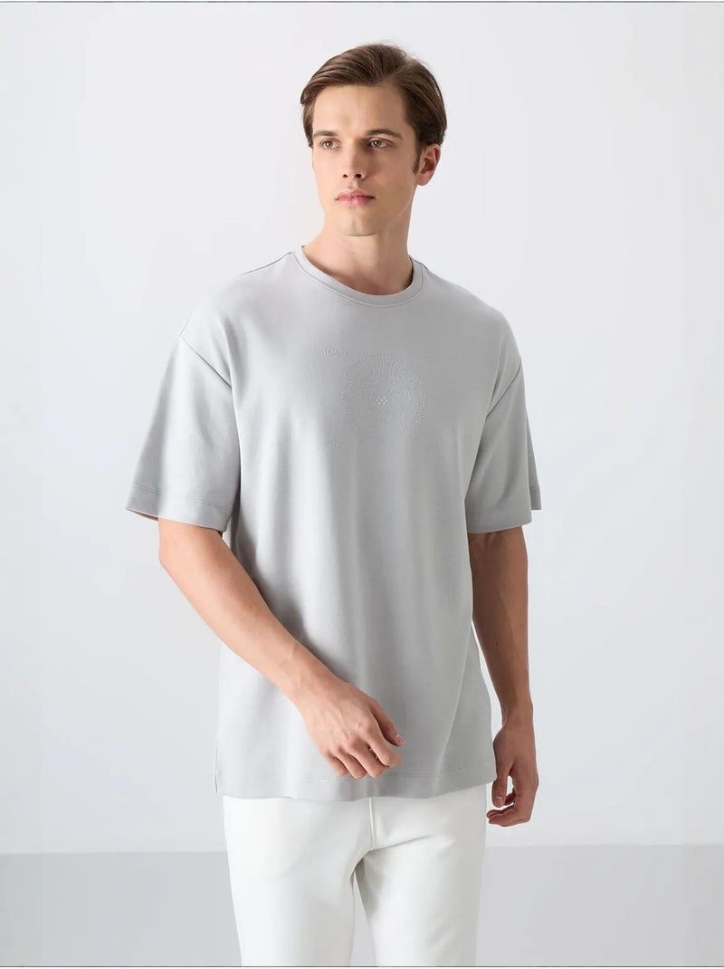 T-shirt girocollo oversize in misto cotone tommy Grigio chiaro - Kiabi