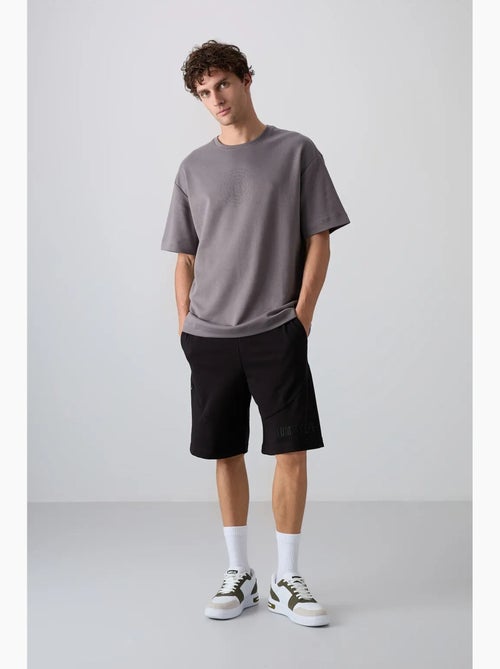 T-shirt girocollo oversize in misto cotone tommy - Kiabi T-shirt girocollo oversize in misto cotone tommy - Kiabi
