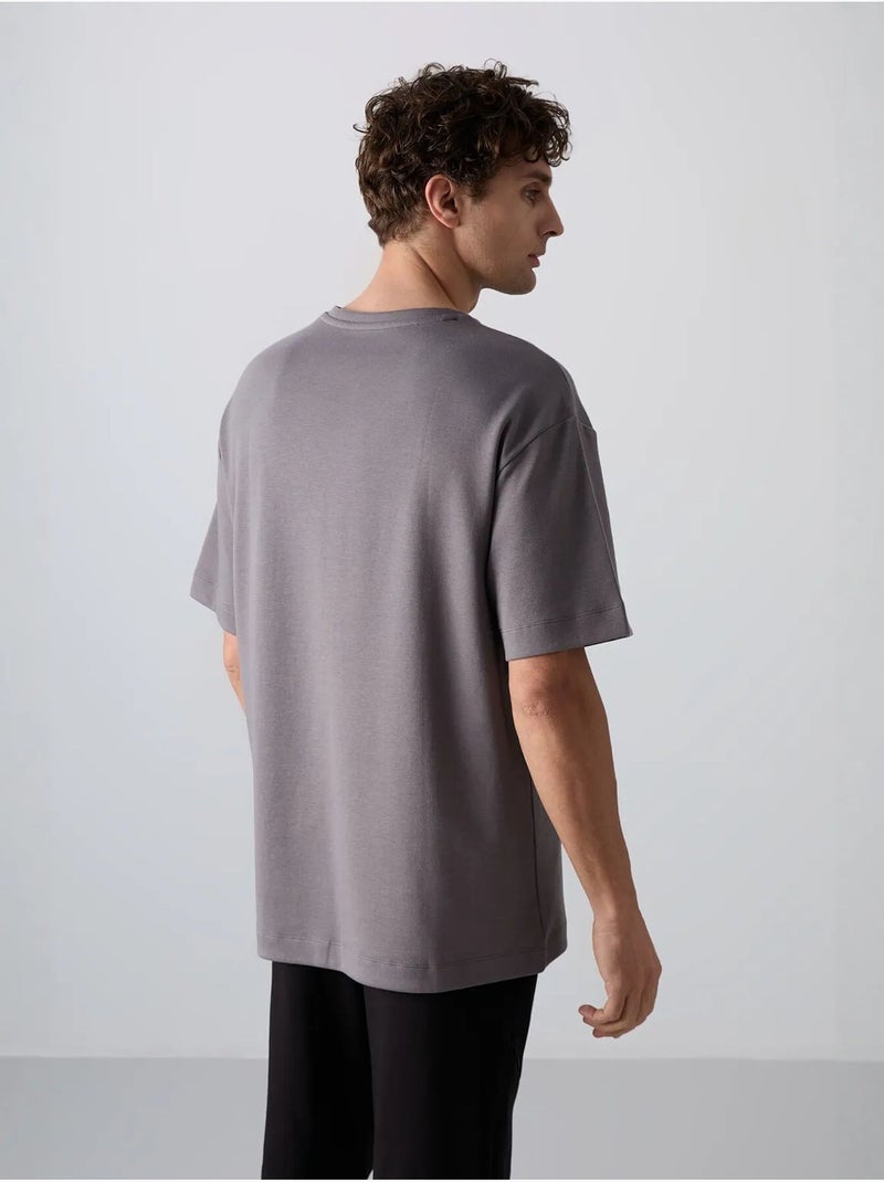 T-shirt girocollo oversize in misto cotone tommy Grigio nero - Kiabi