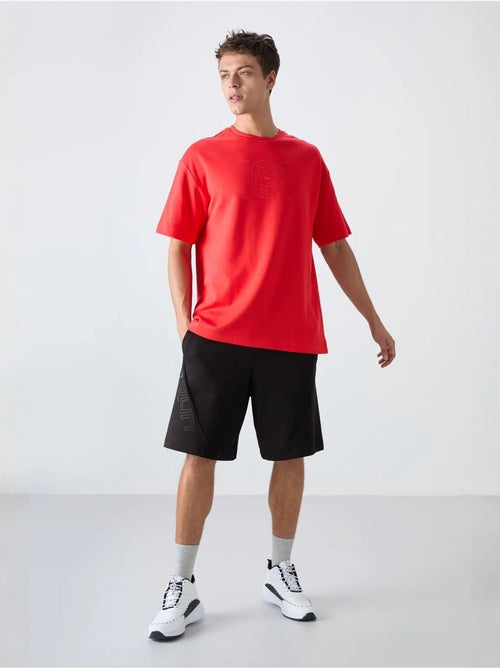 T-shirt girocollo oversize in misto cotone tommy - Kiabi T-shirt girocollo oversize in misto cotone tommy - Kiabi