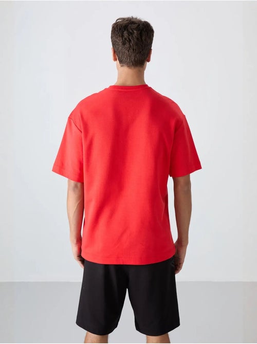 T-shirt girocollo oversize in misto cotone tommy - Kiabi T-shirt girocollo oversize in misto cotone tommy - Kiabi