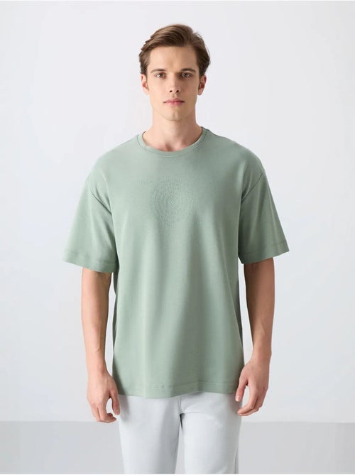 T-shirt girocollo oversize in misto cotone tommy - Kiabi T-shirt girocollo oversize in misto cotone tommy - Kiabi