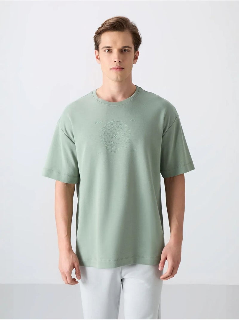 T-shirt girocollo oversize in misto cotone tommy Verde - Kiabi