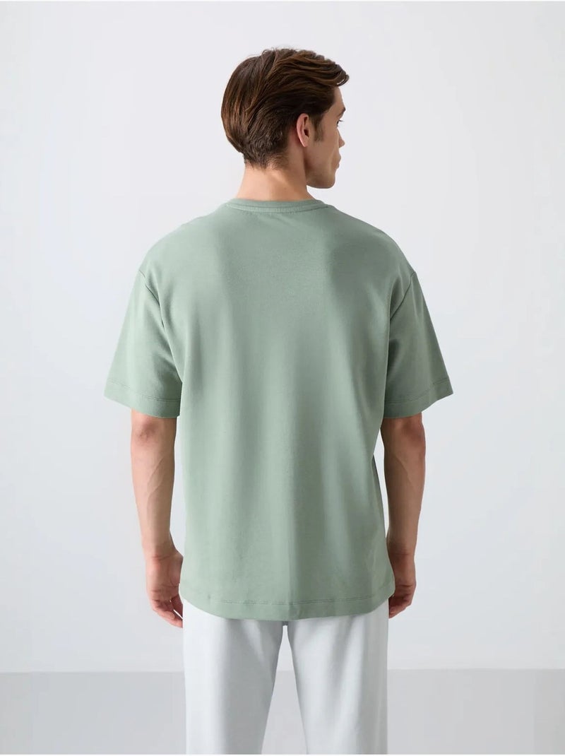 T-shirt girocollo oversize in misto cotone tommy Verde - Kiabi