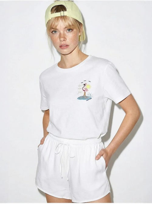 T-shirt in cotone con girocollo ricamata lucci - Kiabi T-shirt in cotone con girocollo ricamata lucci - Kiabi