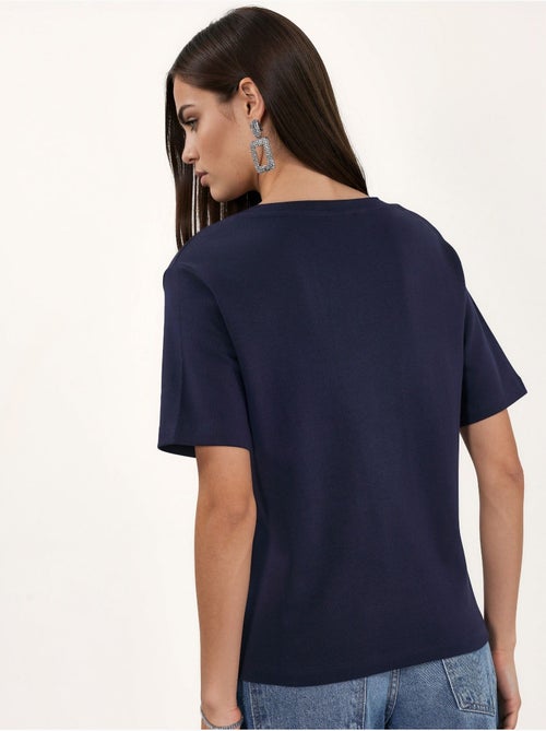 T-shirt in cotone con scollo a v dalla vestibilità regolare tinta unita busem - Kiabi T-shirt in cotone con scollo a v dalla vestibilità regolare tinta unita busem - Kiabi