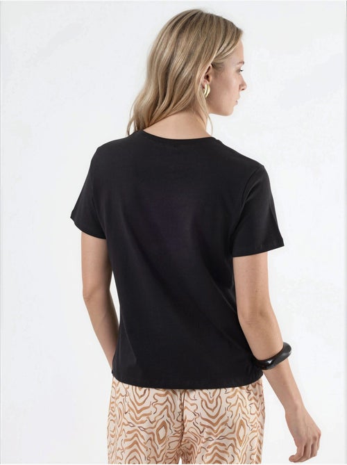 T-shirt in cotone tinta unita con girocollo busem - Kiabi T-shirt in cotone tinta unita con girocollo busem - Kiabi