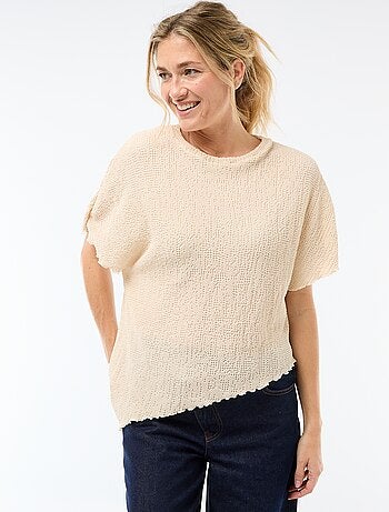 T-shirt in maglia con base asimmetrica