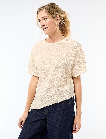 T-shirt in maglia con base asimmetrica