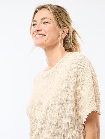 T-shirt in maglia con base asimmetrica