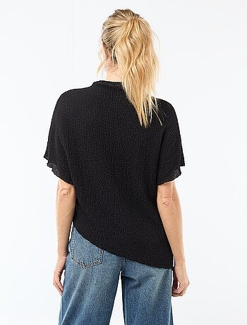 T-shirt in maglia con base asimmetrica