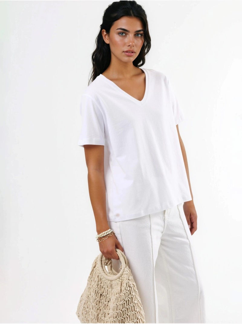T-shirt in maglia tinta unita con scollo a v busem Bianco - Kiabi