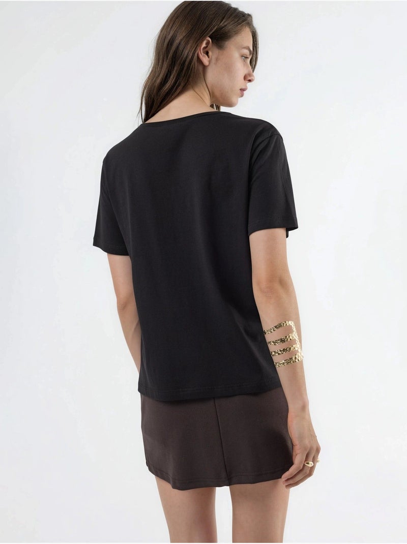 T-shirt in maglia tinta unita con scollo a v busem Nero - Kiabi
