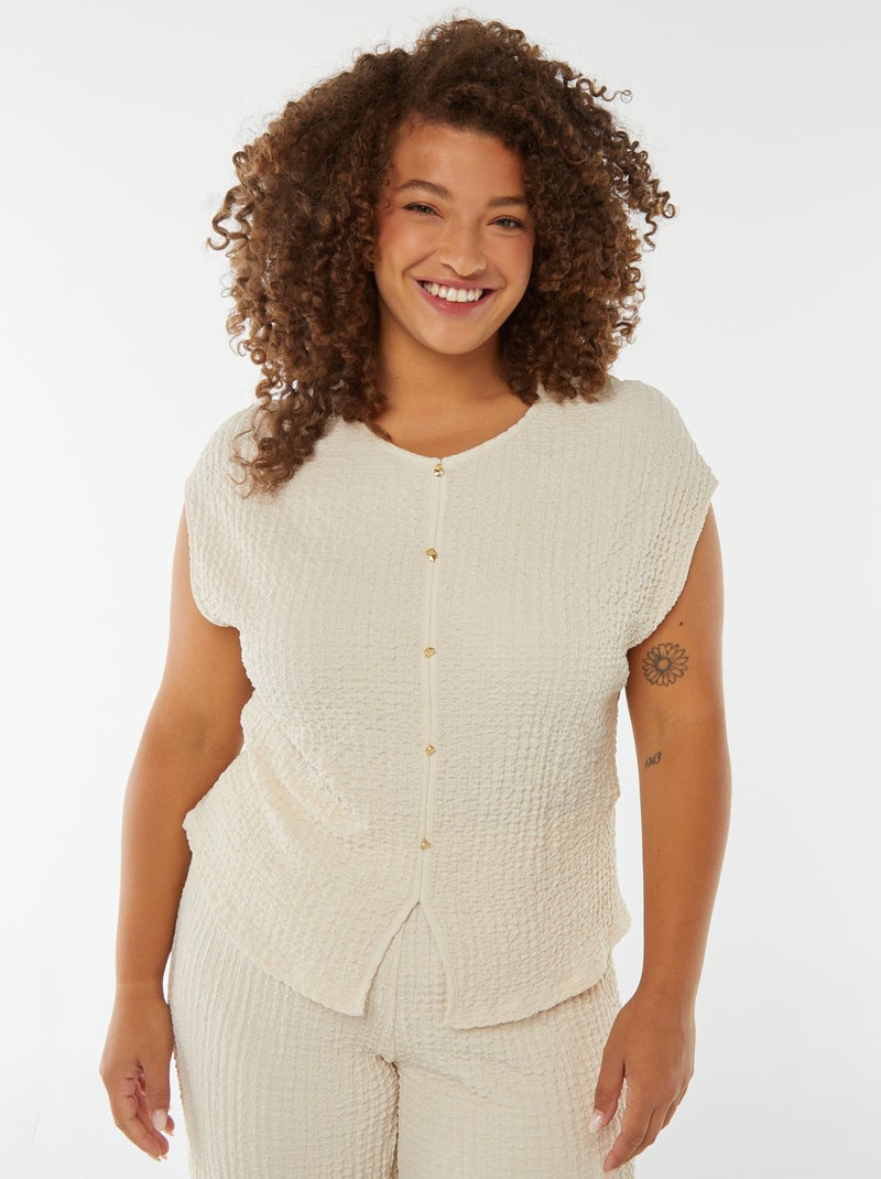 T-shirt in tessuto goffrato senza maniche beige - Kiabi