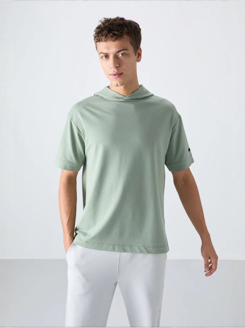 T-shirt oversize con cappuccio e maniche corte tommy - Kiabi T-shirt oversize con cappuccio e maniche corte tommy - Kiabi